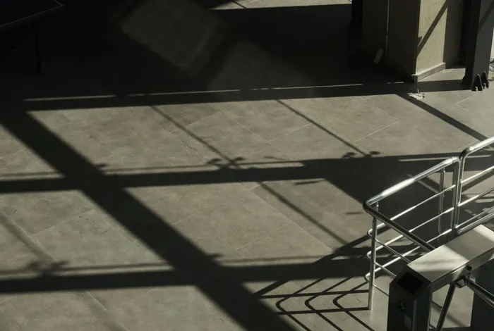 A natural grey concrete floor with shadows