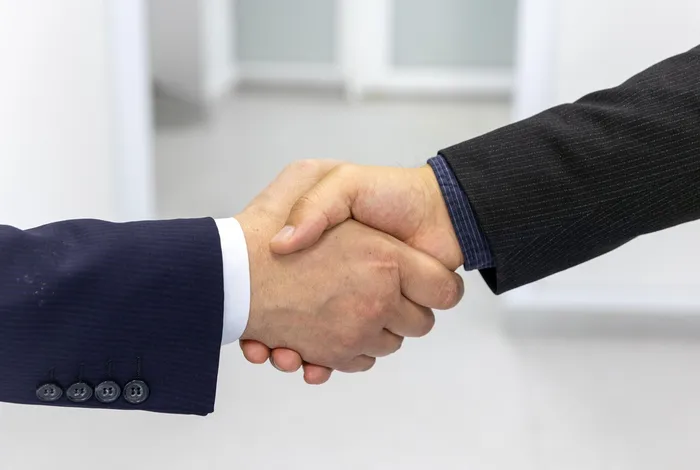 A handshake after an agreement