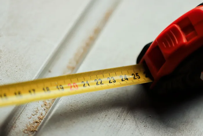 A tape measure on a concrete surface
