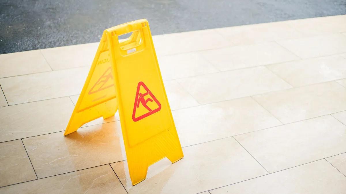 A wet floor warning sign